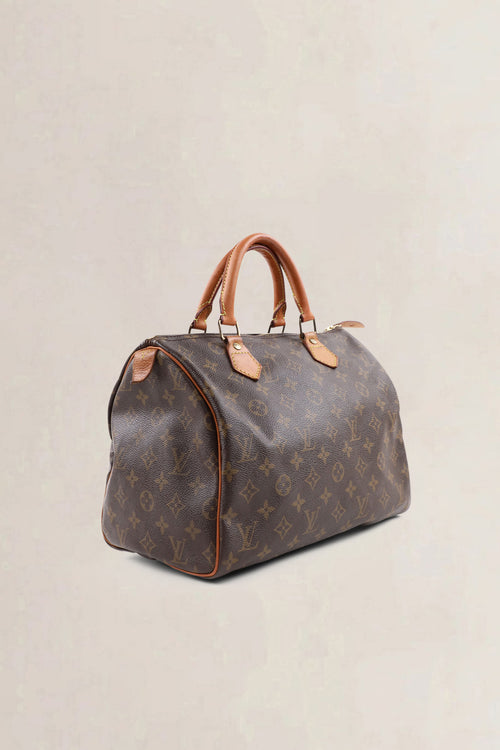 Louis Vuitton Classic Monogram Speedy 25 Top Handle Bag
