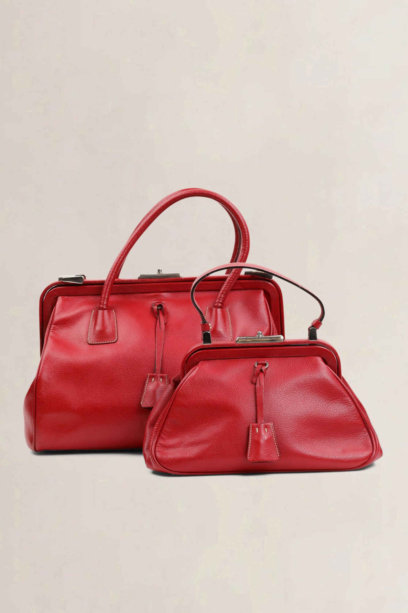 Pair of Prada Red Doctors Top Handle Bag