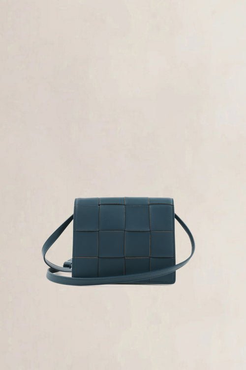 Bottega Veneta Mini Cassette crossbody in petrol blue intrecciato leer