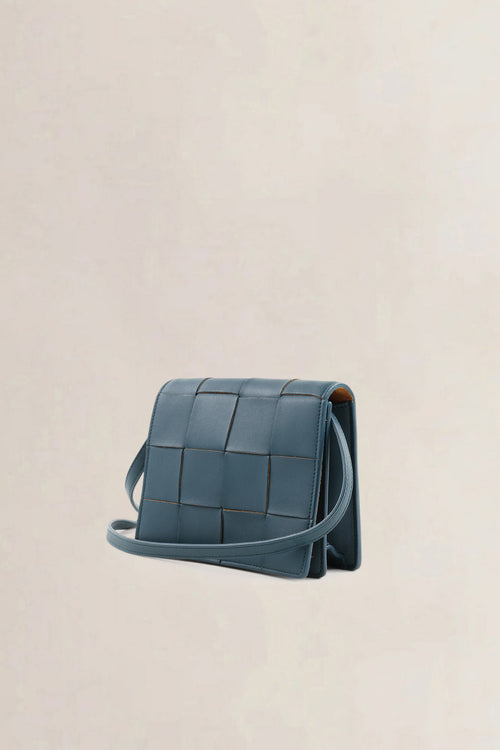 Bottega Veneta Mini Cassette crossbody in petrol blue intrecciato leer