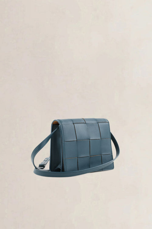 Bottega Veneta Mini Cassette crossbody in petrol blue intrecciato leer
