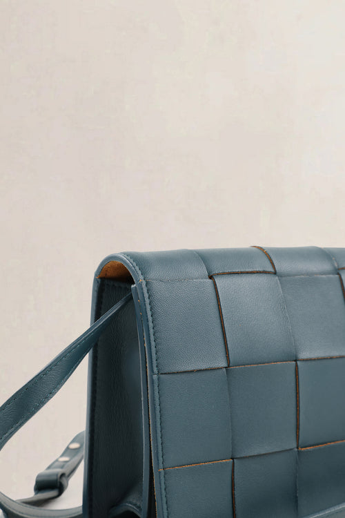Bottega Veneta Mini Cassette crossbody in petrol blue intrecciato leer